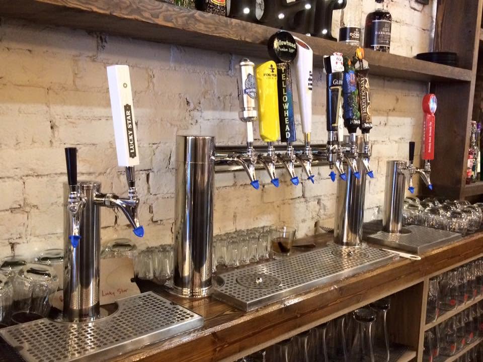 Multi-tap draft beer wall at a neighbourhood bar