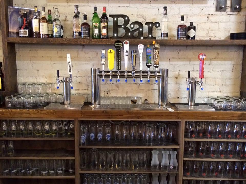 Multiple beer towers lined up during assembly at DSI's shop