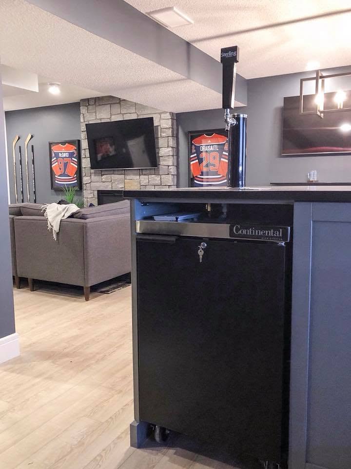 Home kegerator installed in an Edmonton Oilers themed fan cave